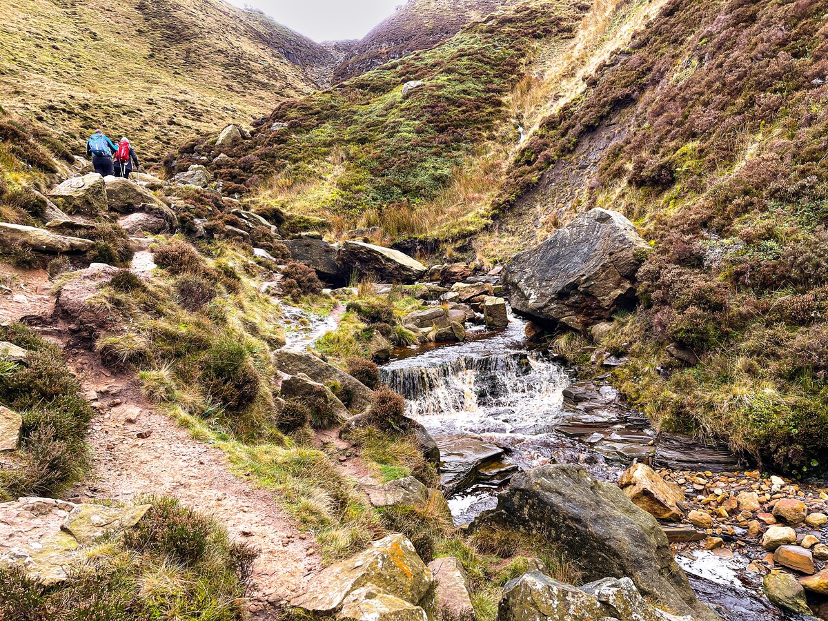 Crossing the stream and boulders on the way up Grinds Brook